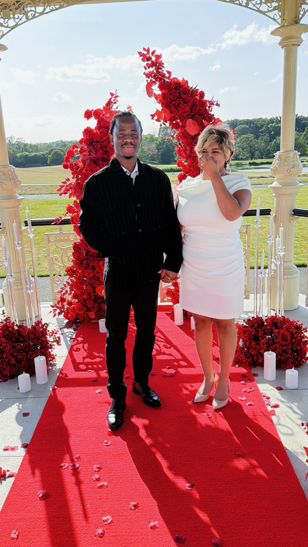 Victor and Andrea walking down the red carpet hand in hand after the proposal